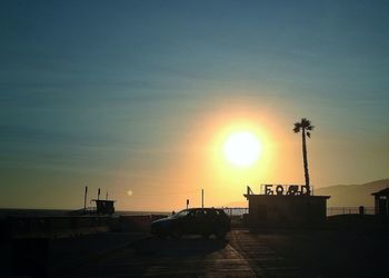 Silhouette of building at sunset