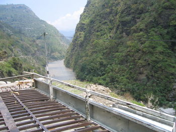 High angle view of bridge over mountains against sky