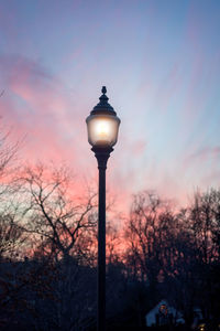 Low angle view of street light against sky at sunset