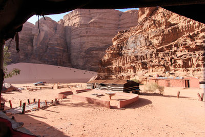 Tent at desert against mountain