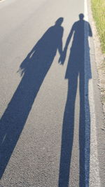 High angle view of people shadow on floor