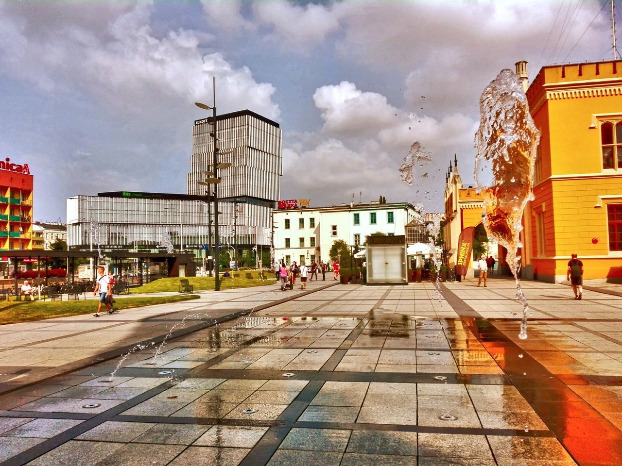 building exterior, architecture, sky, cloud - sky, built structure, city, street, nature, building, incidental people, transportation, outdoors, day, road, footpath, direction, the way forward, mode of transportation, sunlight