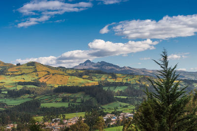 Scenic view of landscape against blue sky