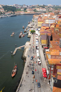 High angle view of boats at harbor in city