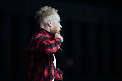 Side view of young man looking away