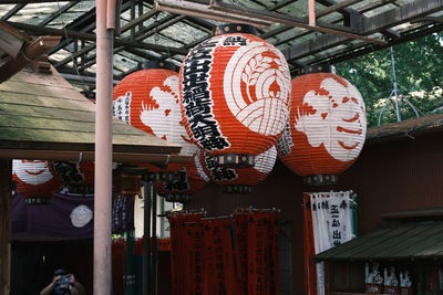 Low angle view of lanterns hanging outside building