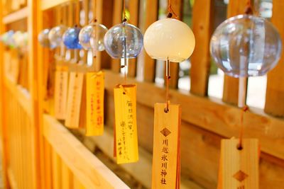 Close-up of colorful lanterns hanging on wood