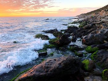 Scenic view of sea against sky during sunset