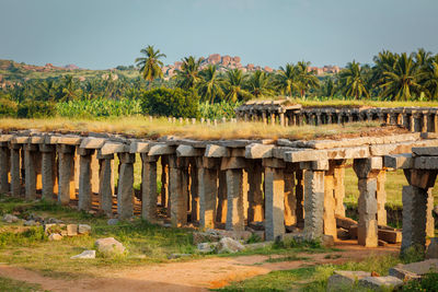 Built structure on field against sky