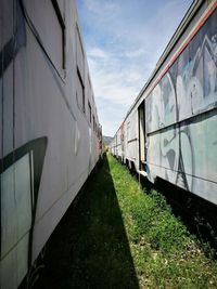 Train on railroad track against sky