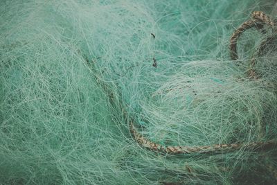 Full frame shot of fishing net on field