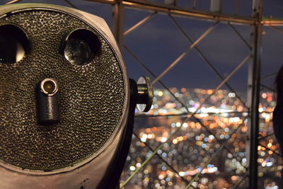 Close-up of illuminated cityscape against sky