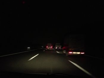 Cars on road at night