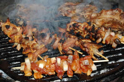 Close-up of meat on barbecue grill