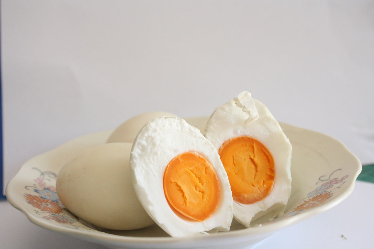 food and drink, food, egg, freshness, still life, indoors, no people, white background, studio shot, ready-to-eat, close-up, healthy eating, plate, egg yolk, wellbeing, boiled egg, table, white color, copy space, boiled, breakfast, eggcup, temptation