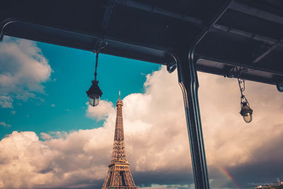 Low angle view of tower against cloudy sky