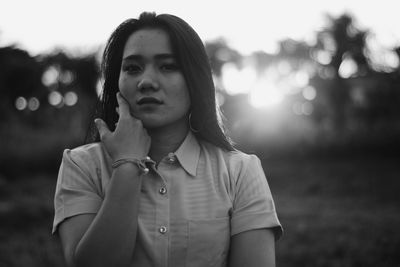Portrait of young woman standing outdoors