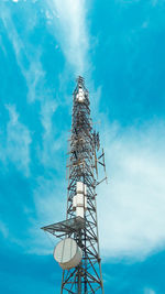 Low angle view of communications tower against sky