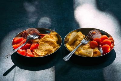 Two plates with breakfast on kitchen counter