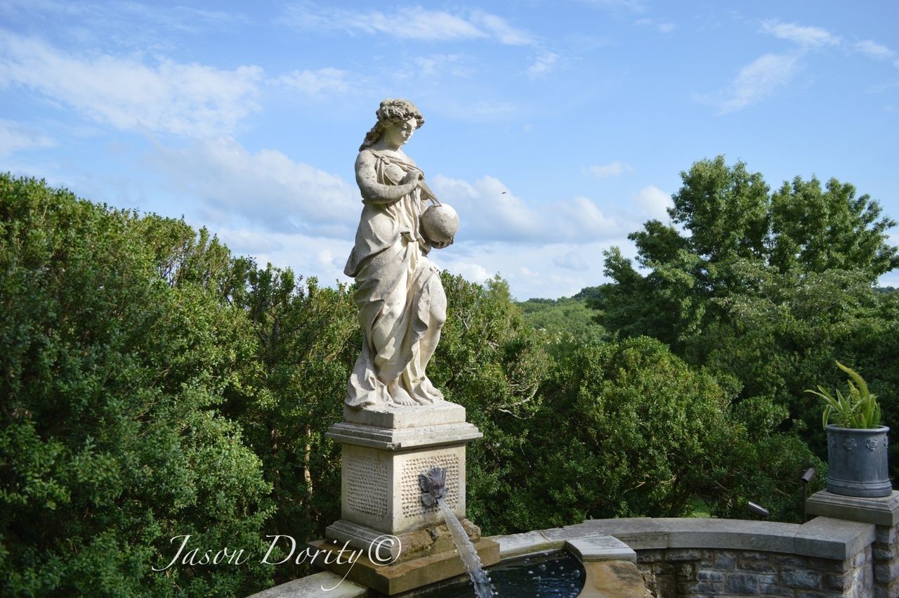 statue, sculpture, human representation, art and craft, art, creativity, tree, sky, low angle view, animal representation, monument, craft, carving - craft product, memorial, travel destinations, famous place, cloud - sky, day