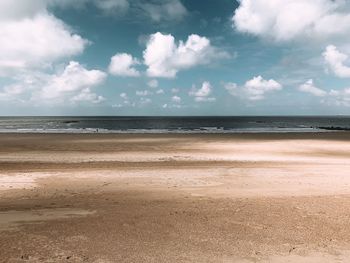 Scenic view of beach against sky