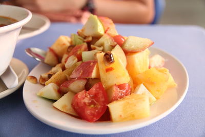 Close-up of fruits in plate on table