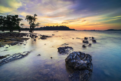 Scenic view of sea against sky during sunset