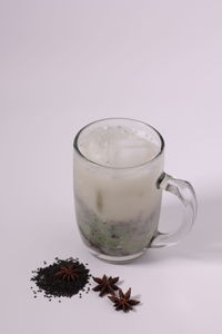 Close-up of coffee on table against white background