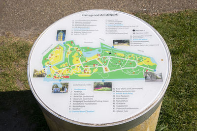 High angle view of information sign on field