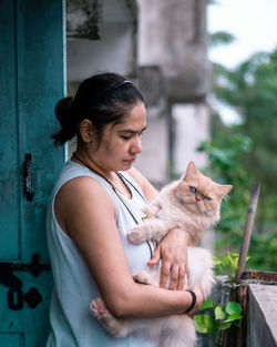 Young woman with cat