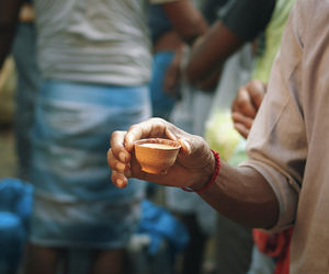 Midsection of man holding ice cream