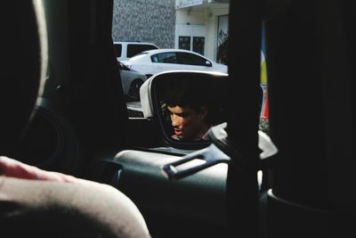 Man sitting in car