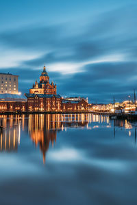 Reflection of illuminated buildings in water