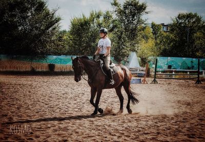 Full length of man riding horse