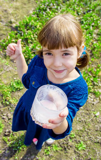 Close-up of cute girl holding ice cream