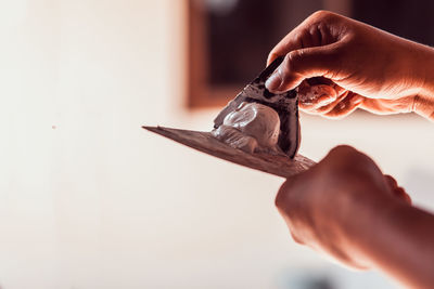 Close-up of person hand holding ice cream