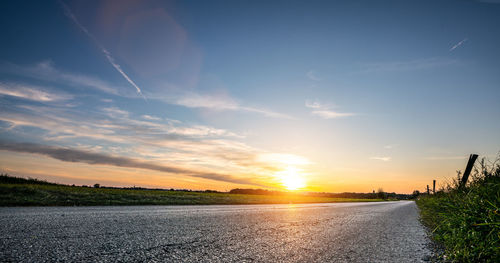 Scenic view of road against sky during sunset