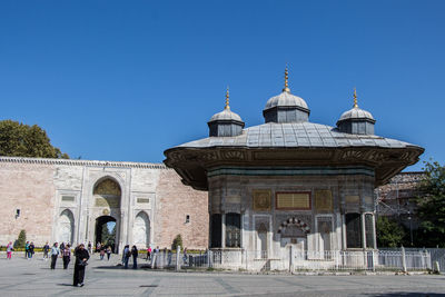 View of historic building against clear blue sky