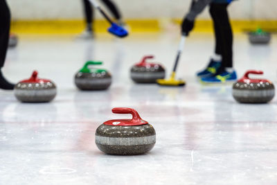 Close-up of curling stones on ice rink