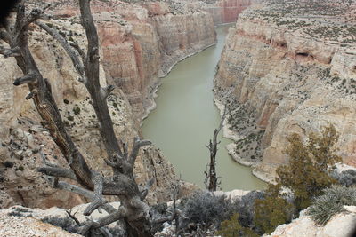 Scenic view of river amidst mountains