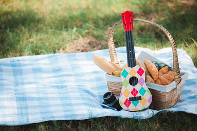 High angle view of wicker basket on field