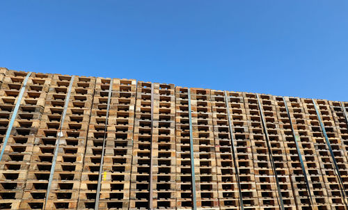 Low angle view of building against clear blue sky