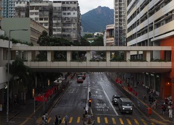 Vehicles on road along buildings