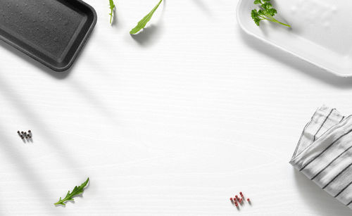 High angle view of personal accessories on white background