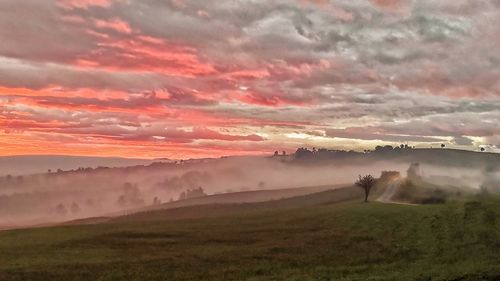 Scenic view of landscape against sky during sunset