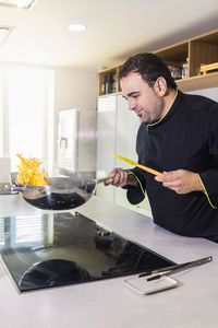  chef preparing food in kitchen at restaurant