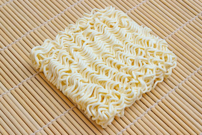 High angle view of noodles on wood