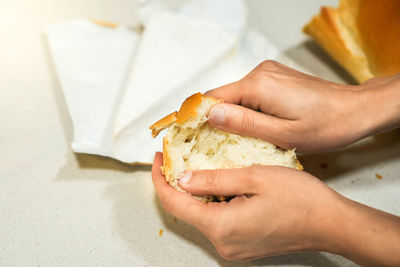 Cropped hand of person holding food