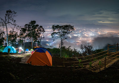 Tent on field against sky
