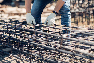 Low section of men working at construction site